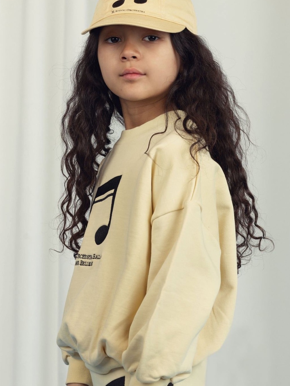Mini Rodini Yellow Sweatshirt with Black Music Note Graphic